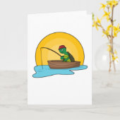 カエルが釣り竿を持って船に乗る カード (黄色い花)