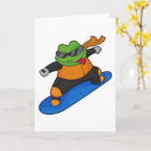 カエルとしてスノーボーダーとスノーボード カード (黄色い花)