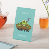 カエルは緑のおもしろいカエルの漫画を支配 台座サイン (インサイチュ)