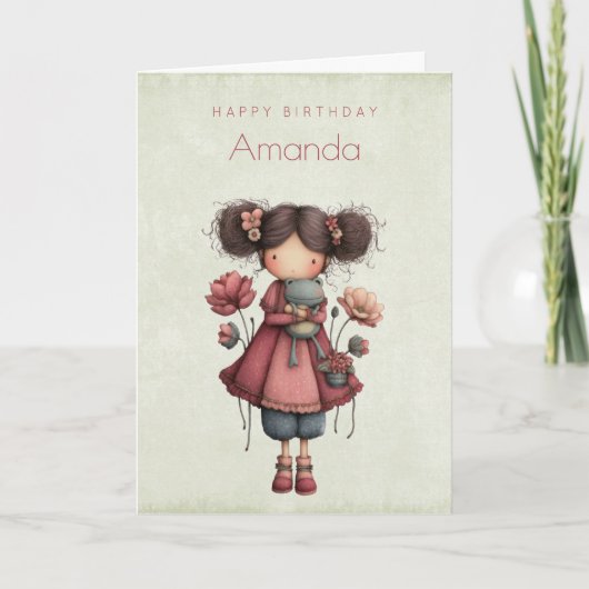 カエル人形を持つ女の子 かわいいファンタジーな誕生日 カード (正面)