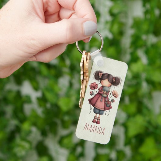 カエル人形を持つ少女 かわいいファンタジー キーホルダー (手)