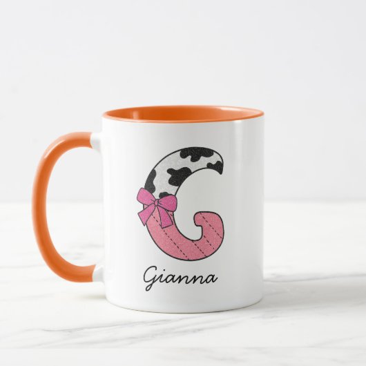 カスタムイニシャルネームマグ | ピンクカウレター G マグカップ (左)