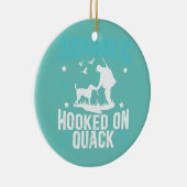 カックに引っ掛けられたダッカホリック水鳥狩り セラミックオーナメント (右)