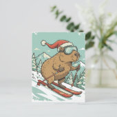 カピバラのスキー　クリスマス　ウィンタースポーツ　面白いデザイン ポストカード (スタンド正面)
