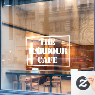 カフェ名がウィンドウに貼り付けられている ウィンドウサイン