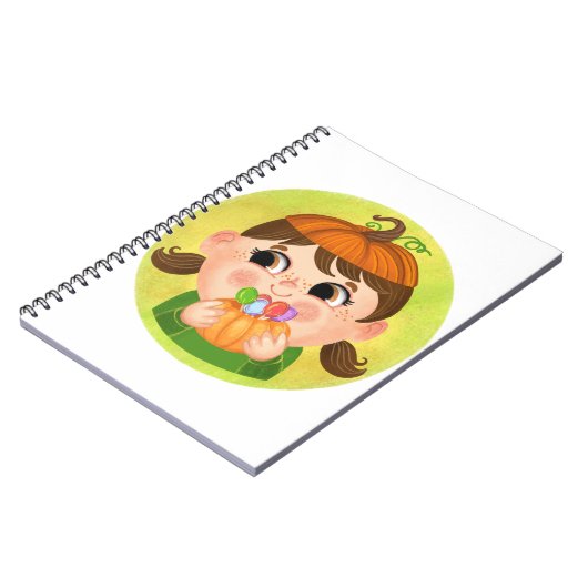 カボチャのハロウィーンの衣装を着たかわいい女の子 ノートブック (左側)