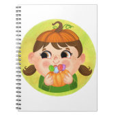 カボチャのハロウィーンの衣装を着たかわいい女の子 ノートブック (正面)