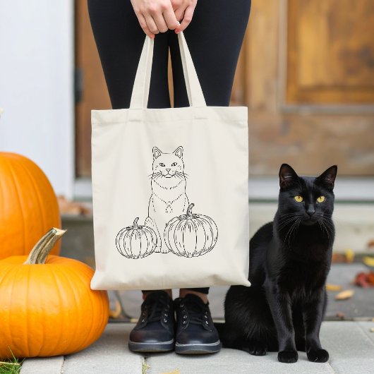 カボチャのラインアートかわいいハロウィンを持つ猫 トートバッグ