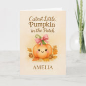 カボチャを持つベビーガールへの初感謝祭 カード (正面)