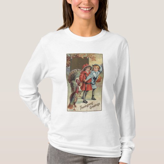 カボチャ、七面鳥を握っている子供 Tシャツ (正面)