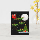 カマキリのサンタが魔法のそりを飛ばす面白いクリスマス カード (黄色い花)