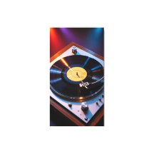 カラフルな光の下で回るビンテージのレコード