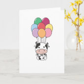 カラフルな風船で牛が飛び上がる カード (黄色い花)