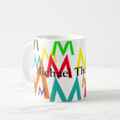 カラフル文字のイニシャルパターンを作成 コーヒーマグカップ (正面左)