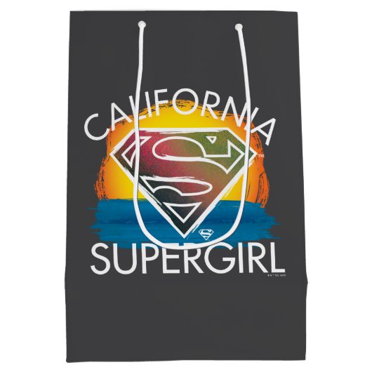カリフォルニアのスーパーガールサンセットグラフィック ミディアムペーパーバッグ (裏面)
