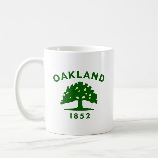 カリフォルニア州オークランドの旗 コーヒーマグカップ (左)