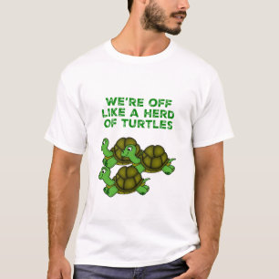 ガメの群れのように去おもしろいる Tシャツ