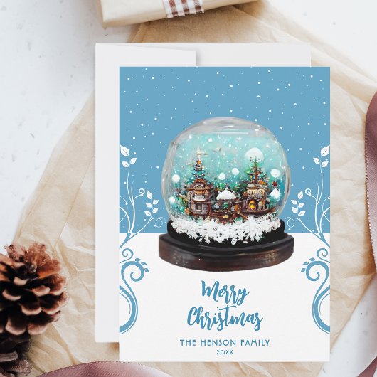 ガラスの雪玉の冬の村の葉のクリスマス シーズンカード