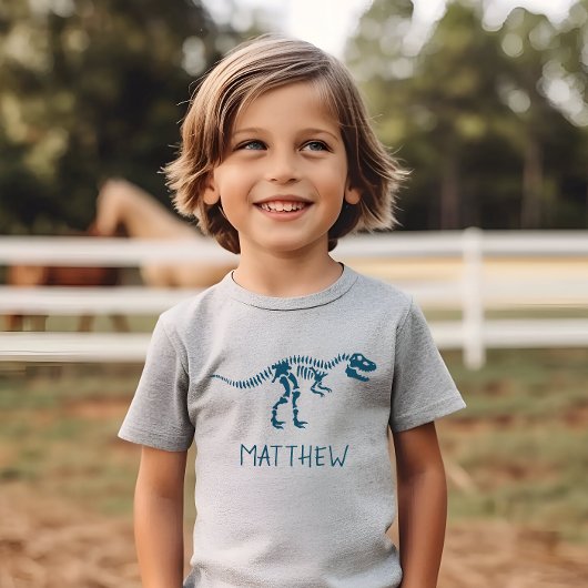 キッズクール恐竜の発掘スケルトン少年 Tシャツ