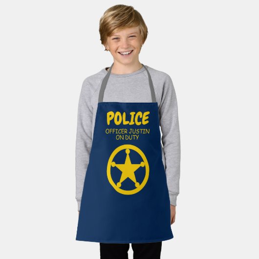 キッズポリスをテーマにしたアートと工芸品のキッチンエプロン エプロン (着用した状態)