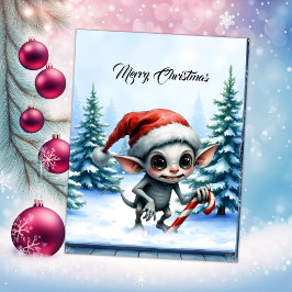 キャンディケインを持つふざけたクリスマスエルフ。 シーズンカード