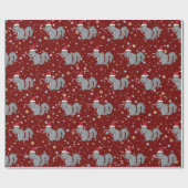 キャンディ・ケーンを握り、サンタの帽子を身に着けているリス ラッピングペーパー (フラット)