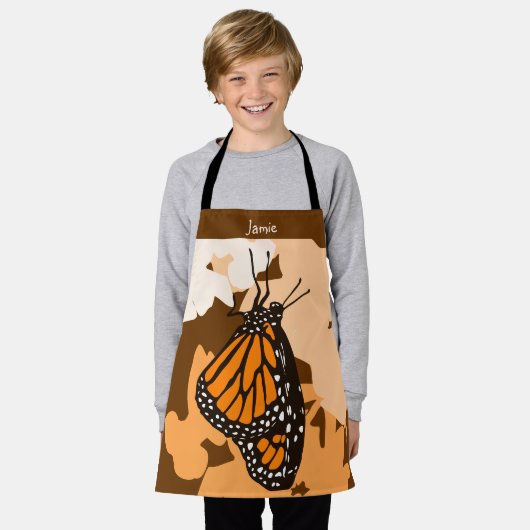 キュートな様式化オレンジ(昆虫)オオカバマダラ、モナークバタフライキッド エプロン (着用した状態)