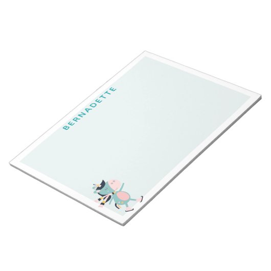 キュートアイススケートで滑るユニコーンティール(緑がかった色)ピンク名前をカスタムする ノートパッド (アングル)