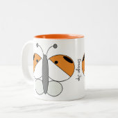 キュートカラフルバタフライマグ – オレンジ色の先端 ツートーンマグカップ (正面左)