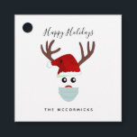キュートCovid 19 Christmas Reindeer着用顔マスク フェイバータグ<br><div class="desc">これらのキュートCovid 19クリスマストナカイ着用顔マスクメッセージカードで休日の贈り物にいくつかのおもしろいを追加。おもしろいデザインは、赤い鼻トナカイ顔がCovid-19コロナウイルスマスクと赤いサンタハットを着ている。挨拶は、トレンディーの手レタリングフォントの中後を追で家族の名前でパーソナライズされた「ハッピーホリデー」である。クリック後を追のオプションとプロンプト</div>