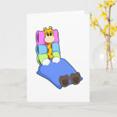 キリンが毛布と枕で寝ている カード (黄色い花)