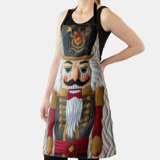 キルティングされたクリスマスくるみ割り エプロン (インサイチュ)