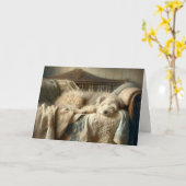 キルトの上で眠っている毛むくじゃらの犬 カード (黄色い花)