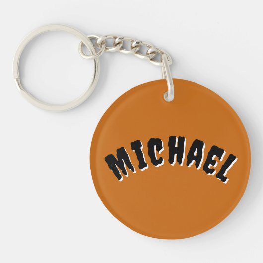 キーチェ不気味ーンの名前（濃いオレンジと黒） キーホルダー (正面)