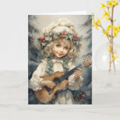 ギターを弾くかわいい女の子のクリスマス カード (黄色い花)
