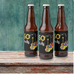 ギター50 Rocks 50th birthday party ビールラベル<br><div class="desc">50 Rocks 50th birthday party beer labels黒地に水の色のギタクールーデザインを3つ付ける。火炎パターンと赤ピックガード付きのエレキギター、数々のカラーのセミアコースティックギター、およびブラックと金ゴールドのタイポグラフィを備えたサイケデリッククラシックアコースティックパーソナライズされたギターアートのイラストレーションを使用したエレキモダンュタクールギター。テンプレートを使って時代を変えるこの簡単は、ロックンロールスタイルで50まで完璧なパーティーデコールを作り出し、ギタリスト、ミュージシャン、音楽愛好家に理想的である。ギタープレーヤーは決してギターの数が多すぎないことを教えてくれる。このクールミュージカルモダン楽器デザインは、この素晴らしいミュージカル楽器の音楽エネルギーと50番目の誕生祝いをロックするための完璧な方法である。オリジナルのアートワークby artist Catherine Sweetman</div>