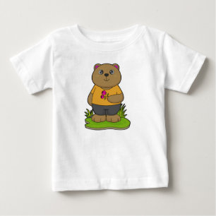 クマと花 ベビーTシャツ