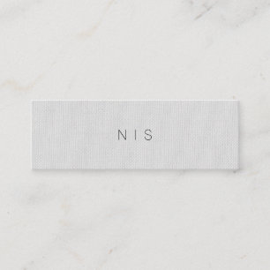 クラシックな最小主義の灰色のリネン背景の美しい スキニー名刺