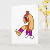 クリケットの会場でのホットドッグ(クリケットのバット付き) カード (黄色い花)