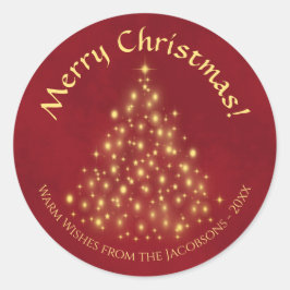 クリスマスおめでとう！ 真紅の背景に金のライトのツリー ラウンドシール