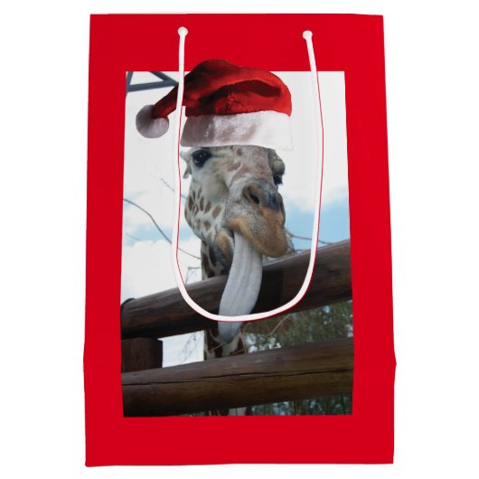 クリスマスにサンタクロースの帽子をかぶったキリン ミディアムペーパーバッグ (裏面)