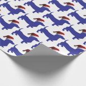 クリスマスにサンタクロースの帽子をかぶったダシュント ラッピングペーパー (角)