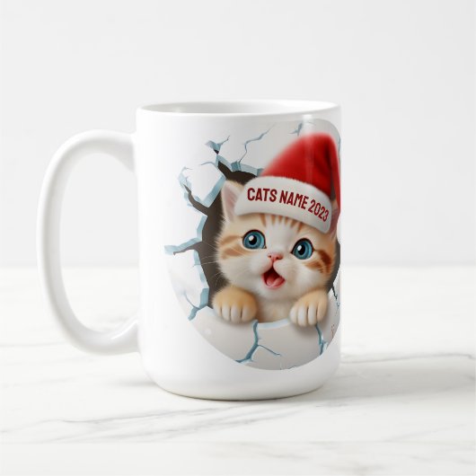 クリスマスにサンタ帽子をかぶったかわいい子猫 コーヒーマグカップ (左)