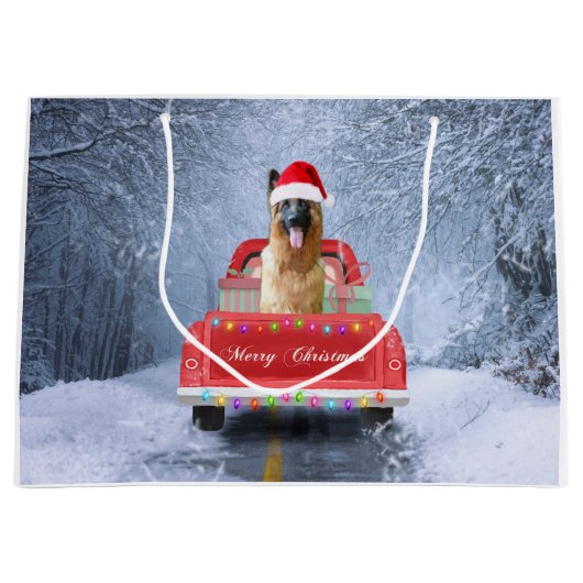 クリスマスに座っている雪の中のドイツの羊飼い犬 ラージペーパーバッグ (正面)