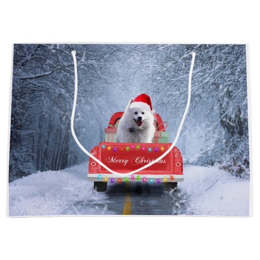 クリスマスに座る雪の中のアメリカのエスキモー犬 ラージペーパーバッグ (正面)