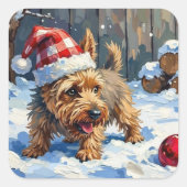 クリスマスのために穴を掘る活発なケアン・テリアの犬 スクエアシール (正面)