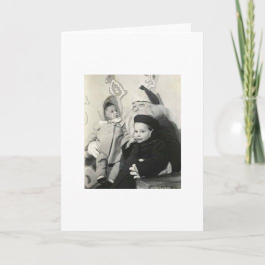 クリスマスのためのサンタのラップに坐っている子供 シーズンカード (正面)