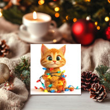 クリスマスのイルミネーションに絡まる子猫