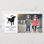 クリスマスのサンタクロースの帽子を身に着けている黒い実験室犬 シーズンカード (正面)