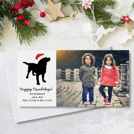 クリスマスのサンタクロースの帽子を身に着けている黒い実験室犬 シーズンカード